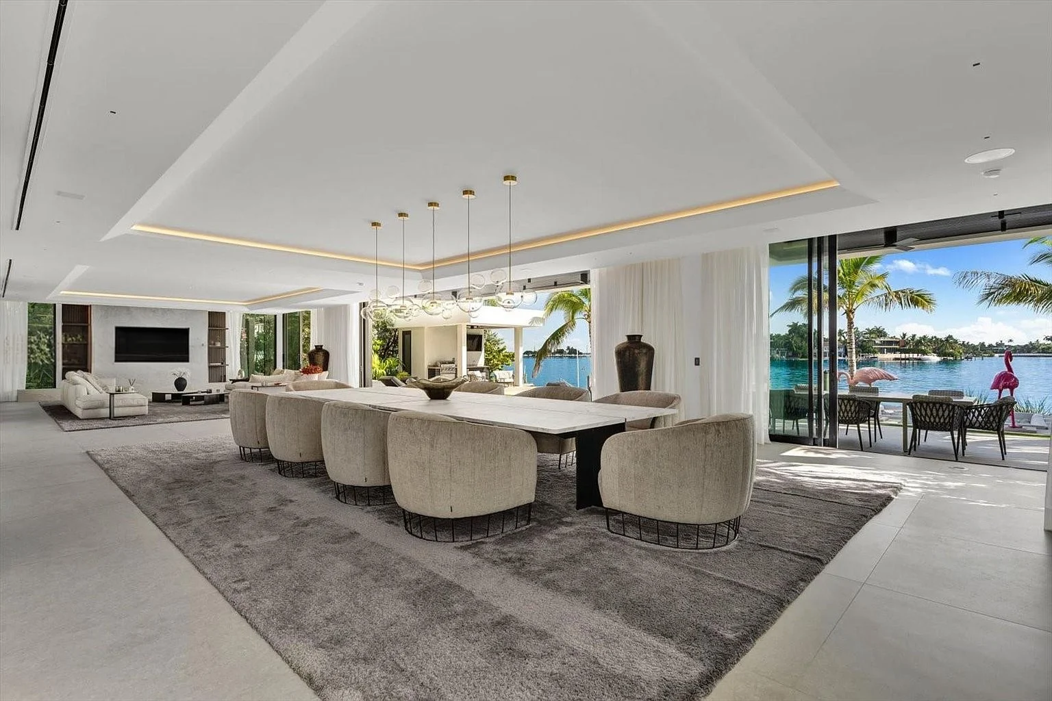 Dining table beside full-height glazing