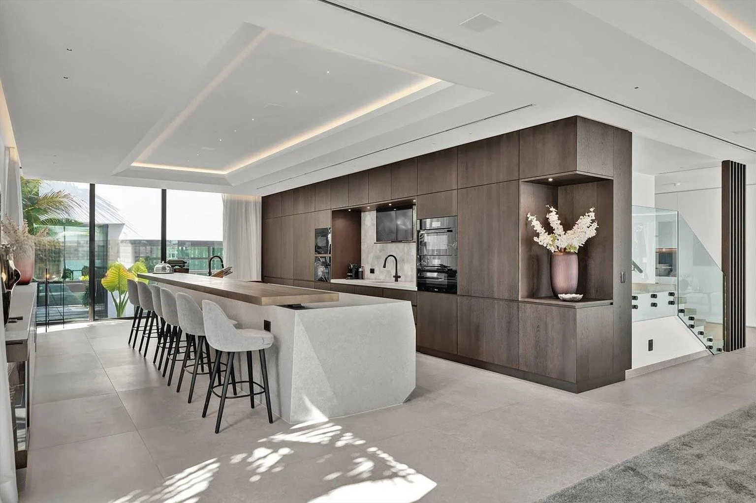 Kitchen with stone island and timber cabinetry