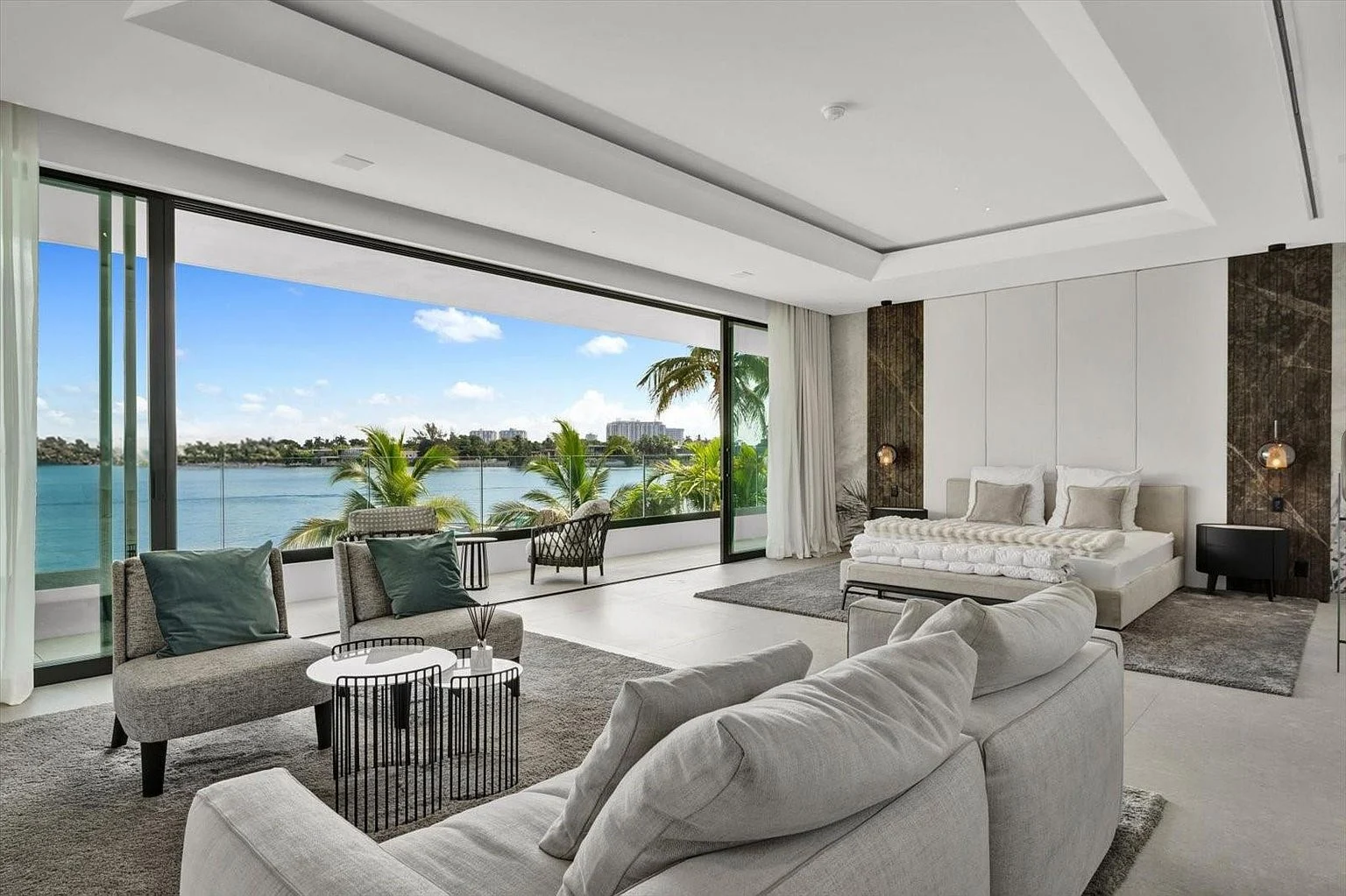 Primary bedroom with a wide outlook toward the bay